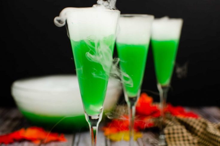 green cocktail with dry ice